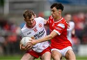 28 May 2025; Liam Óg Mossey of Tyrone in action against Shane Lennon of Louth during the Dalata Hotel Group GAA Football All-Ireland U20 Championship final match between Louth and Tyrone at BOX-IT Athletic Grounds in Armagh. Photo by Seb Daly/Sportsfile