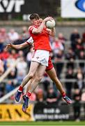 28 May 2025; Seán Callaghan of Louth in action against Conor O’Neill of Tyrone during the Dalata Hotel Group GAA Football All-Ireland U20 Championship final match between Louth and Tyrone at BOX-IT Athletic Grounds in Armagh. Photo by Seb Daly/Sportsfile