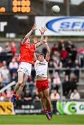28 May 2025; Seán Callaghan of Louth in action against Conor O’Neill of Tyrone during the Dalata Hotel Group GAA Football All-Ireland U20 Championship final match between Louth and Tyrone at BOX-IT Athletic Grounds in Armagh. Photo by Seb Daly/Sportsfile