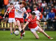 28 May 2025; Conall Sheehy of Tyrone is tackled by Tadgh McDonell of Louth during the Dalata Hotel Group GAA Football All-Ireland U20 Championship final match between Louth and Tyrone at BOX-IT Athletic Grounds in Armagh. Photo by Seb Daly/Sportsfile