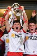 28 May 2025; Tyrone captain Joey Clarke, left, lifts the trophy alongside team-mate Eoin McElholm after their side's victory in the Dalata Hotel Group GAA Football All-Ireland U20 Championship final match between Louth and Tyrone at BOX-IT Athletic Grounds in Armagh. Photo by Oliver McVeigh/Sportsfile