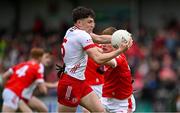 28 May 2025; Joey Clarke of Tyrone in action against Cormac McKeown of Louth during the Dalata Hotel Group GAA Football All-Ireland U20 Championship final match between Louth and Tyrone at BOX-IT Athletic Grounds in Armagh. Photo by Seb Daly/Sportsfile