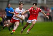 28 May 2025; Liam Óg Mossey of Tyrone in action against Shane Lennon of Louth during the Dalata Hotel Group GAA Football All-Ireland U20 Championship final match between Louth and Tyrone at BOX-IT Athletic Grounds in Armagh. Photo by Seb Daly/Sportsfile