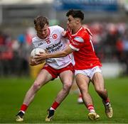 28 May 2025; Liam Óg Mossey of Tyrone in action against Shane Lennon of Louth during the Dalata Hotel Group GAA Football All-Ireland U20 Championship final match between Louth and Tyrone at BOX-IT Athletic Grounds in Armagh. Photo by Seb Daly/Sportsfile