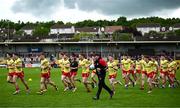 28 May 2025; Tyrone manager Paul Devlin and players before the Dalata Hotel Group GAA Football All-Ireland U20 Championship final match between Louth and Tyrone at BOX-IT Athletic Grounds in Armagh. Photo by Seb Daly/Sportsfile
