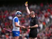 25 May 2025; Referee Johnny Murphy shows the yellow card to Stephen Bennett of Waterford during the Munster GAA Hurling Senior Championship Round 5 match between Cork and Waterford at SuperValu Páirc Ui Chaoimh in Cork. Photo by Piaras Ó Mídheach/Sportsfile