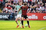 30 May 2025; Dayle Rooney of Bohemians in action against Kevin Holt of Derry City during the SSE Airtricity Men's Premier Division match between Bohemians and Derry City at Dalymount Park in Dublin. Photo by Seb Daly/Sportsfile