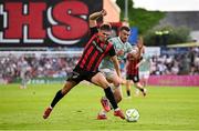 30 May 2025; Dayle Rooney of Bohemians in action against Michael Duffy of Derry City during the SSE Airtricity Men's Premier Division match between Bohemians and Derry City at Dalymount Park in Dublin. Photo by Seb Daly/Sportsfile