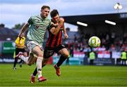 30 May 2025; Ronan Boyce of Derry City in action against Dayle Rooney of Bohemians during the SSE Airtricity Men's Premier Division match between Bohemians and Derry City at Dalymount Park in Dublin. Photo by Seb Daly/Sportsfile