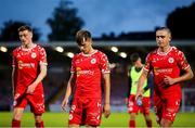 30 May 2025; Shelbourne players, from left, Daniel Kelly, James Norris, and Evan Caffrey after the SSE Airtricity Men's Premier Division match between Cork City and Shelbourne at Turner's Cross in Cork. Photo by Michael P Ryan/Sportsfile
