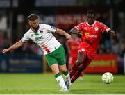 30 May 2025; Greg Bolger of Cork City in action against Mipo Odubeko of Shelbourne during the SSE Airtricity Men's Premier Division match between Cork City and Shelbourne at Turner's Cross in Cork. Photo by Michael P Ryan/Sportsfile