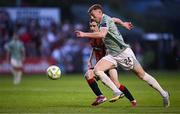 30 May 2025; Sam Todd of Derry City in action against Dawson Devoy of Bohemians during the SSE Airtricity Men's Premier Division match between Bohemians and Derry City at Dalymount Park in Dublin. Photo by Seb Daly/Sportsfile