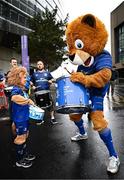 31 May 2025; Leinster supporters Kyla Blake, age 7, from Wicklow, drums with Leinster mascot Leo the Lion before the United Rugby Championship quarter-final match between Leinster and Scarlets at the Aviva Stadium in Dublin. Photo by Seb Daly/Sportsfile