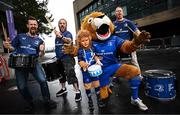 31 May 2025; Leinster supporters Kyla Blake, age 7, from Wicklow, poses for a photographer with Leinster mascot Leo the Lion and Hit Machine drummers before the United Rugby Championship quarter-final match between Leinster and Scarlets at the Aviva Stadium in Dublin. Photo by Seb Daly/Sportsfile