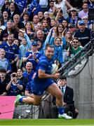 31 May 2025; Leinster supporters cheer on James Lowe as he runs in their side's first try during the United Rugby Championship quarter-final match between Leinster and Scarlets at the Aviva Stadium in Dublin. Photo by Seb Daly/Sportsfile