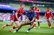 31 May 2025; James Lowe of Leinster scores his side's first try despite the efforts of Arhie Hughes of Scarlets during the United Rugby Championship quarter-final match between Leinster and Scarlets at the Aviva Stadium in Dublin. Photo by Brendan Moran/Sportsfile