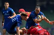 31 May 2025; James Lowe of Leinster is tackled by Henry Thomas of Scarlets during the United Rugby Championship quarter-final match between Leinster and Scarlets at the Aviva Stadium in Dublin. Photo by Brendan Moran/Sportsfile