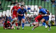 31 May 2025; Jamison Gibson-Park of Leinster is tackled by Tom Rogers of Scarlets during the United Rugby Championship quarter-final match between Leinster and Scarlets at the Aviva Stadium in Dublin. Photo by Brendan Moran/Sportsfile