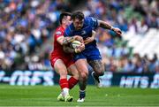 31 May 2025; Andrew Porter of Leinster is tackled by Joe Roberts of Scarlets during the United Rugby Championship quarter-final match between Leinster and Scarlets at the Aviva Stadium in Dublin. Photo by Brendan Moran/Sportsfile
