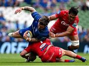 31 May 2025; Andrew Porter of Leinster is tackled by Scarlets players Alec Hepburn, bottom, and Sam Lousi during the United Rugby Championship quarter-final match between Leinster and Scarlets at the Aviva Stadium in Dublin. Photo by Seb Daly/Sportsfile