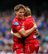 31 May 2025; Blair Murray of Scarlets, right, celebrates with teammate Ellis Mee after scoring their side's second try during the United Rugby Championship quarter-final match between Leinster and Scarlets at the Aviva Stadium in Dublin. Photo by Tyler Miller/Sportsfile