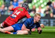 31 May 2025; Jamie Osborne of Leinster scores his side's third try despite the efforts of Tom Rogers of Scarlets during the United Rugby Championship quarter-final match between Leinster and Scarlets at the Aviva Stadium in Dublin. Photo by Brendan Moran/Sportsfile