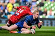 31 May 2025; Jamie Osborne of Leinster scores his side's third try despite the efforts of Tom Rogers of Scarlets during the United Rugby Championship quarter-final match between Leinster and Scarlets at the Aviva Stadium in Dublin. Photo by Brendan Moran/Sportsfile