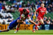 31 May 2025; Vaea Fifita of Scarlets is tackled by Scott Penny of Leinster during the United Rugby Championship quarter-final match between Leinster and Scarlets at the Aviva Stadium in Dublin. Photo by Tyler Miller/Sportsfile