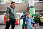 31 May 2025; Republic of Ireland's Katie McCabe shows her UEFA Women's Champions League winners medal to Republic of Ireland and Arsenal supporter Georgie Ring, age 5, from Carrigaline, Cork, on the team's arrival at Cork International Airport ahead of their UEFA Women's Nations League match against Slovenia at Páirc Uí Chaoimh in Cork on Tuesday. Photo by Stephen McCarthy/Sportsfile