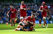 31 May 2025; Hugo Keenan of Leinster scores his side's fourth try, despte the tackle to Scarlets players Johnny Williams and Blair Murray, during the United Rugby Championship quarter-final match between Leinster and Scarlets at the Aviva Stadium in Dublin. Photo by Seb Daly/Sportsfile