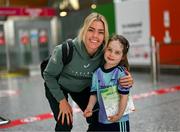 31 May 2025; Republic of Ireland's Denise O’Sullivan with supporter Georgie Ring, age 5, from Carrigaline, Cork, on the team's arrival at Cork International Airport ahead of their UEFA Women's Nations League match against Slovenia at Páirc Uí Chaoimh in Cork on Tuesday. Photo by Stephen McCarthy/Sportsfile