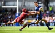 31 May 2025; Sam Prendergast of Leinster evades the tackle of Josh Macleod of Scarlets during the United Rugby Championship quarter-final match between Leinster and Scarlets at the Aviva Stadium in Dublin. Photo by Seb Daly/Sportsfile