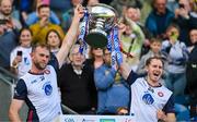 31 May 2025; New York captain Johnny Glynn, left, and James Breen lift the Lory Meagher Cup after the Lory Meagher Cup final match between Cavan and New York at Croke Park in Dublin. Photo by Stephen Marken/Sportsfile