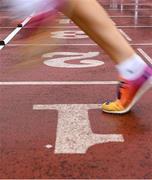 31 May 2025; A runner is seen crossing the finishing line during the 123.ie All-Ireland Schools Track and Field Championships at Tullamore Harriers Athletics Club in Offaly. Photo by Shauna Clinton/Sportsfile