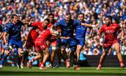 31 May 2025; RG Snyman of Leinster is tackled by Ioan Lloyd of Scarlets during the United Rugby Championship quarter-final match between Leinster and Scarlets at the Aviva Stadium in Dublin. Photo by Brendan Moran/Sportsfile
