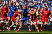 31 May 2025; RG Snyman of Leinster is tackled by Ioan Lloyd and Kemsley Mathias of Scarlets during the United Rugby Championship quarter-final match between Leinster and Scarlets at the Aviva Stadium in Dublin. Photo by Brendan Moran/Sportsfile