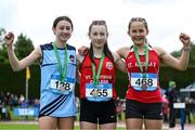 31 May 2025; Chloe McCarthy of St Aloysius Carrigtwohill, Cork, centre, who finished first in the Minor Girls 800m, alongside Darcie Clarke of Lumen Chrisit Derry, left, who finished second, and Siri O'Flynn of St Angelas Waterford, who finished third, during the 123.ie All-Ireland Schools Track and Field Championships at Tullamore Harriers Athletics Club in Offaly. Photo by Shauna Clinton/Sportsfile