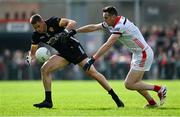 31 May 2025; Pat Havern of Down in action against Tommy Durnin of Louth during the GAA Football All-Ireland Senior Championship Round 2 match between Down and Louth at Páirc Esler in Newry, Down. Photo by Daire Brennan/Sportsfile
