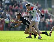 31 May 2025; Pat Havern of Down in action against Peter Lynch of Louth during the GAA Football All-Ireland Senior Championship Round 2 match between Down and Louth at Páirc Esler in Newry, Down. Photo by Daire Brennan/Sportsfile