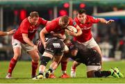 31 May 2025; Gavin Coombes of Munster is tackled by James Venter of Hollywoodbets Sharks and Bongi Mbonambi of Hollywoodbets Sharks during the United Rugby Championship quarter-final match between Hollywoodbets Sharks and Munster at Kings Park Stadium in Durban, South Africa. Photo by Shaun Roy/Sportsfile