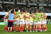 31 May 2025; Munster huddle before the United Rugby Championship quarter-final match between Hollywoodbets Sharks and Munster at Kings Park Stadium in Durban, South Africa. Photo by Shaun Roy/Sportsfile