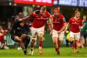 31 May 2025; Gavin Coombes of Munster attempts to break Makazole Mapimpi of Hollywoodbets Sharks attempted tackle during the United Rugby Championship quarter-final match between Hollywoodbets Sharks and Munster at Kings Park Stadium in Durban, South Africa. Photo by Shaun Roy/Sportsfile