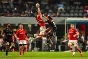 31 May 2025; Calvin Nash of Munster is challenged by Makazole Mapimpi of Hollywoodbets Sharks for the high ball during the United Rugby Championship quarter-final match between Hollywoodbets Sharks and Munster at Kings Park Stadium in Durban, South Africa. Photo by Shaun Roy/Sportsfile
