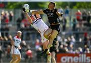 31 May 2025; Daire Nally of Louth in action against Pat Havern of Down during the GAA Football All-Ireland Senior Championship Round 2 match between Down and Louth at Páirc Esler in Newry, Down. Photo by Daire Brennan/Sportsfile