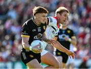 31 May 2025; Danny Magill of Down in action against Conor Grimes of Louth during the GAA Football All-Ireland Senior Championship Round 2 match between Down and Louth at Páirc Esler in Newry, Down. Photo by Daire Brennan/Sportsfile