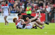 31 May 2025; Ciarán Keenan of Louth in action against Finn McElroy of Down during the GAA Football All-Ireland Senior Championship Round 2 match between Down and Louth at Páirc Esler in Newry, Down. Photo by Daire Brennan/Sportsfile