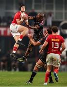 31 May 2025; Mike Haley of Munster beats Makazole Mapimpi of Hollywoodbets Sharks to the high ball during the United Rugby Championship quarter-final match between Hollywoodbets Sharks and Munster at Kings Park Stadium in Durban, South Africa. Photo by Shaun Roy/Sportsfile
