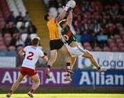 31 May 2025; Tyrone goalkeeper Niall Morgan in action against Jack Carney of Mayo during the GAA Football All-Ireland Senior Championship Round 2 match between Tyrone and Mayo at O'Neills Healy Park in Omagh, Tyrone. Photo by Piaras Ó Mídheach/Sportsfile