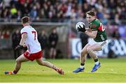 31 May 2025; Paddy Durcan of Mayo in action against Kieran McGeary of Tyrone during the GAA Football All-Ireland Senior Championship Round 2 match between Tyrone and Mayo at O'Neills Healy Park in Omagh, Tyrone. Photo by Piaras Ó Mídheach/Sportsfile