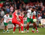 30 May 2025; Djenairo Daniels of Cork City in action against Shelbourne players, from left, John Martin, and Ellis Chapman during the SSE Airtricity Men's Premier Division match between Cork City and Shelbourne at Turner's Cross in Cork. Photo by Michael P Ryan/Sportsfile